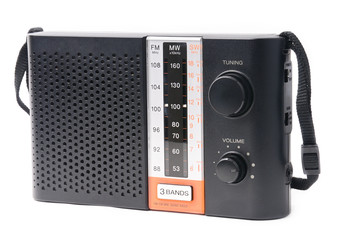 Vintage radio for listening to radio programs on a white background