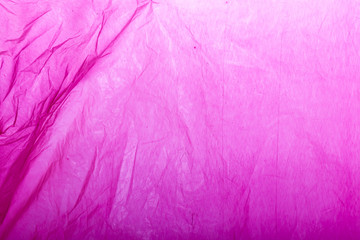 Pink plastic shopping bag as background.
