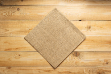 burlap hessian sacking cloth on wooden background