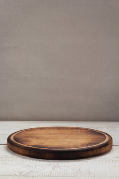 Pizza Cutting Board At Rustic Wooden Table