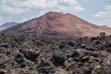 volcanic mountain with road signs in Lanzarote, Canary Island, Spain
