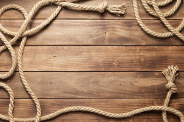 ship rope at wooden board background