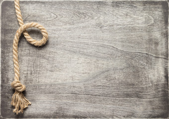 ship rope at wooden board background