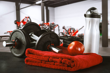 Fototapeta na wymiar Gym interior and dumbbells on board with free space for your decoration. 