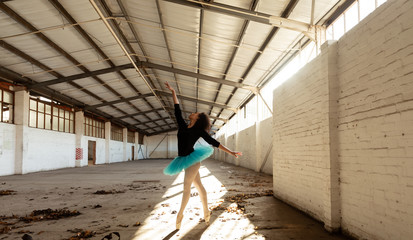 Female dancer in an empty warehouse