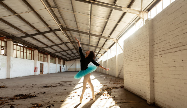 Female dancer in an empty warehouse