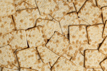 Creamy salty cracker background. Top view. Flat lay