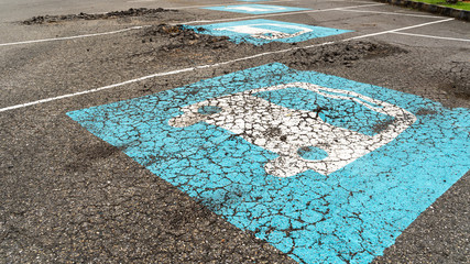 Surface bumpy damaged concrete parking lot © somchairakin