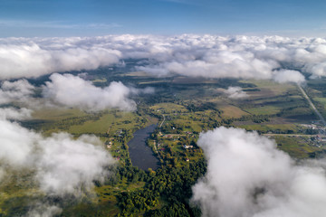 Beautiful views of the countryside from a great height. Flying above the clouds.