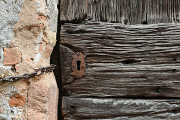 Old wooden background with remains of scrap parts of old paint on wood.