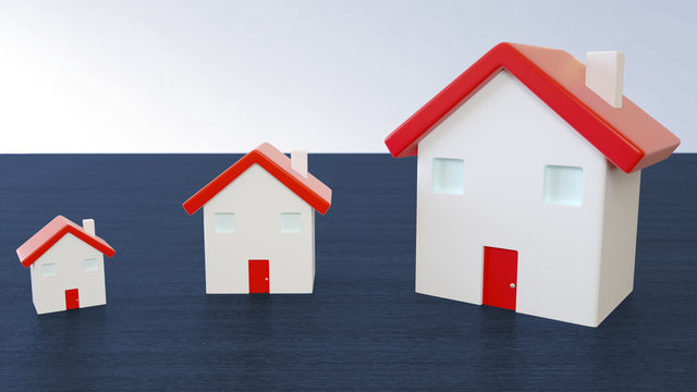 Three miniature houses with red roof on wooden blue background. Image for property real estate, mortgage, insurance and home loan concept.