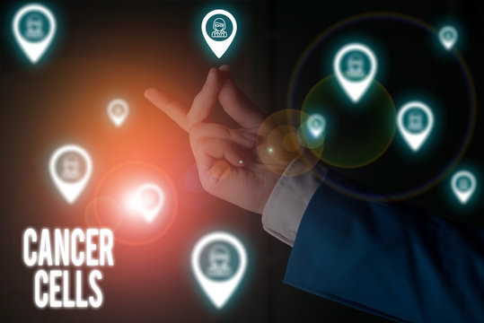 Text sign showing Cancer Cells. Business photo showcasing forming solid tumors or flooding the blood with abnormal cells Male human wear formal work suit presenting presentation using smart device