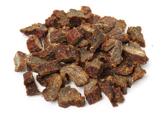 Slices of beef jerky on white background