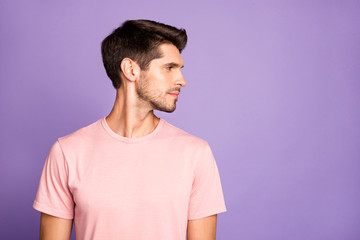 Close-up portrait of his he nice attractive lovely handsome cute calm content bearded brunet guy wearing pink tshirt looking aside isolated on violet purple lilac pastel color background