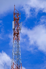 Telecommunication telephone signal transmission tower with beautiful blue sky background