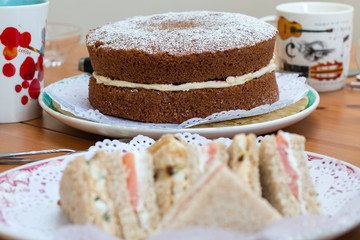 Chocolate sponge cake and sandwiches for afternoon tea. April 2019.