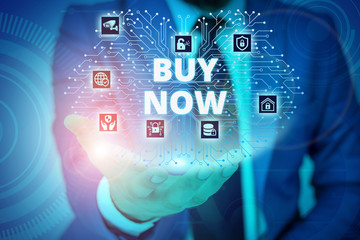 Conceptual hand writing showing Buy Now. Concept meaning asking someone to purchase your product Provide good Discount Male wear formal suit presenting presentation smart device