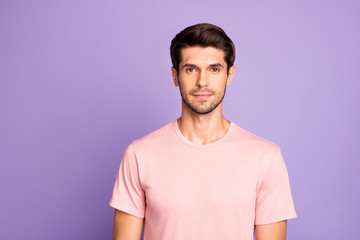 Close-up portrait of his he nice attractive lovely calm content peaceful brunet guy wearing pink tshirt isolated over violet purple lilac pastel color background