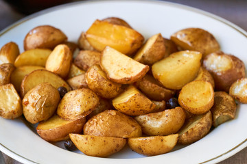 Baked potato wedges on a white plate