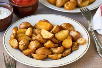 Baked potato wedges on a white plate