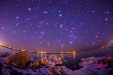 The sea in winter and star tracks