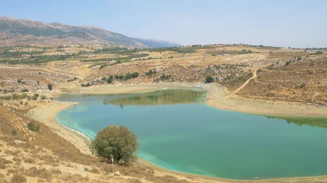 Wide static shot of the banks of Litani river, the longest river of Lebanon, originating in Beeqa Valley and ending up in the Mediterranean Sea