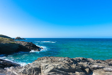 Fototapeta na wymiar Cliff with rocks on the Spanish coast of the Atlantic Ocean