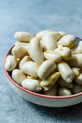 Organic Raw Unsalted White Peanuts in Bowl.