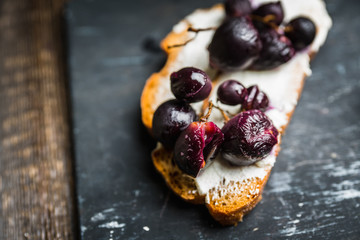 Sandwich with grilled grape and honey. Selective focus. Shallow depth of field.
