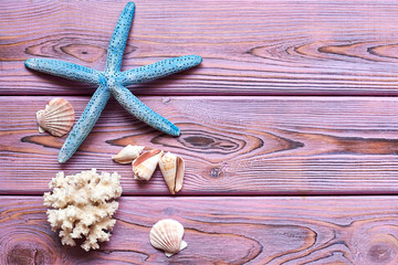 Starfish on a wooden purple background.