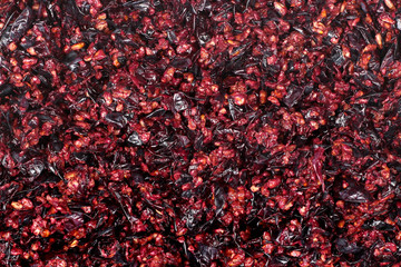Pressed grape pomace, seeds and skins. Winemaking background. - obrazy, fototapety, plakaty