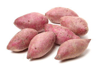 Purple Colored Sweet Potatoes on White background 