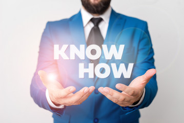 Text sign showing Know How. Business photo showcasing The process to learn of doing things you will do for the first time Man with opened hands in fron of the table. Mobile phone and notes on the
