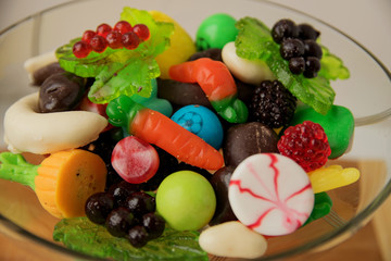 delicious variety of marmalade sweets lie in a glass bowl