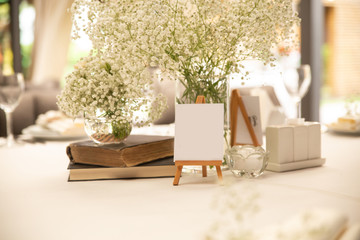 Table setting for  banquet in restauran with white flowers. A beautiful table for any occasion,...