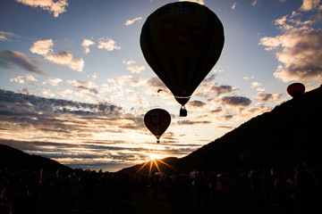 hot air balloons flying at sunset - live your dream, freedom and adrenaline concept