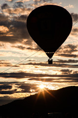 hot air balloons flying at sunset - live your dream, freedom and adrenaline concept