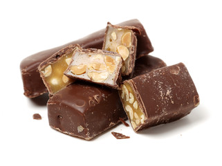 Chocolate peanut candy on white background