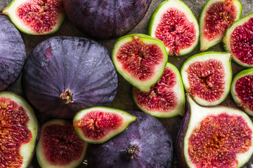 Fresh ripe fig halves. Blue fruit of figs, background - 293568863