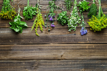 Garden herbs, freshly harvested bunch on wooden table