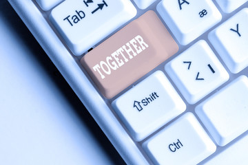 Writing note showing Together. Business concept for In proximity,union or collison with another...