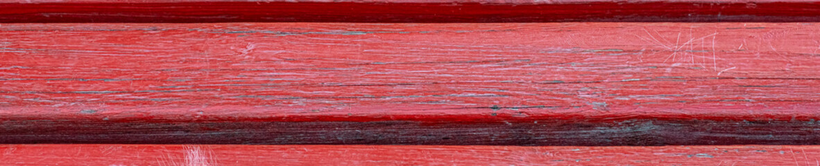 texture surface of a wooden board painted red