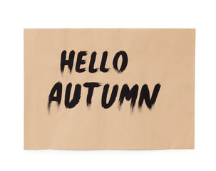 Hello autumn creative text on brown paper sheet on white