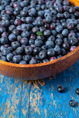 fresh blueberries in a wooden bowl