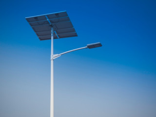 solar panel system with street light lamp post led and blue sky background.