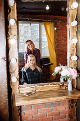 Beautiful woman in hair salon