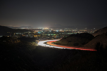 Night view of Simi Valley and route 118 commuter freeway traffic near Los Angeles in Ventura County, California.