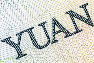 Macro close up photograph of Yuan word on the Chinese currency note.  