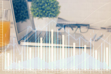 Forex graph hologram on table with computer background. Multi exposure. Concept of financial markets.