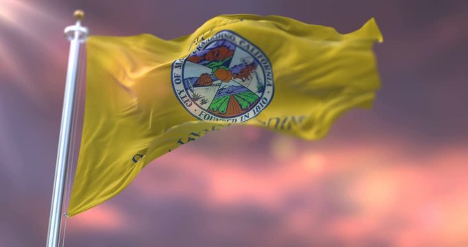 Flag of San Bernardino at sunset, California, in United States of America - loop